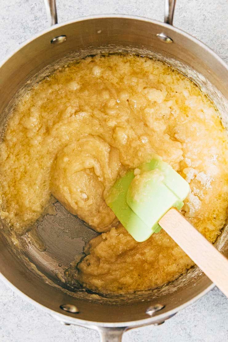 photo showing the cake batter in the pan with lumps after the dry ingredients have been added