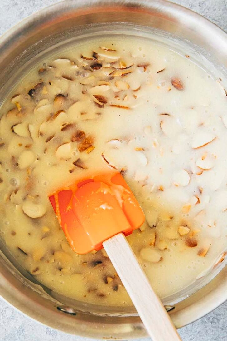 photo showing the frosting in the pan after the almonds have been added and stirred in