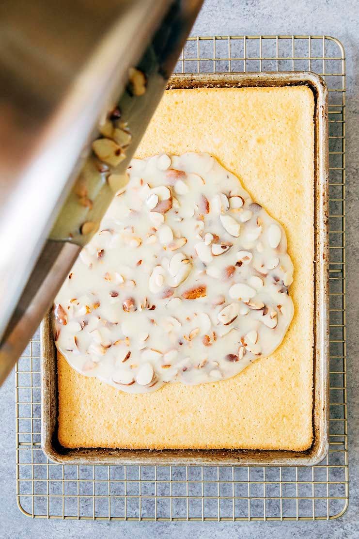 photo showing the process of pouring the frosting over the baked cake