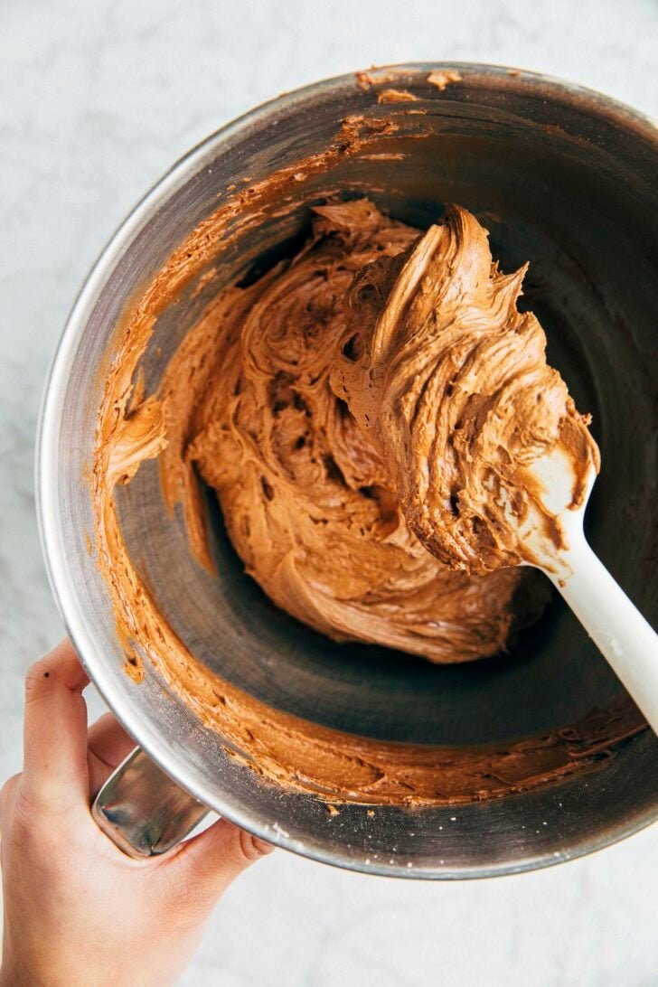 photo of michelle from hummingbird high mixing the chocolate cream cheese frosting