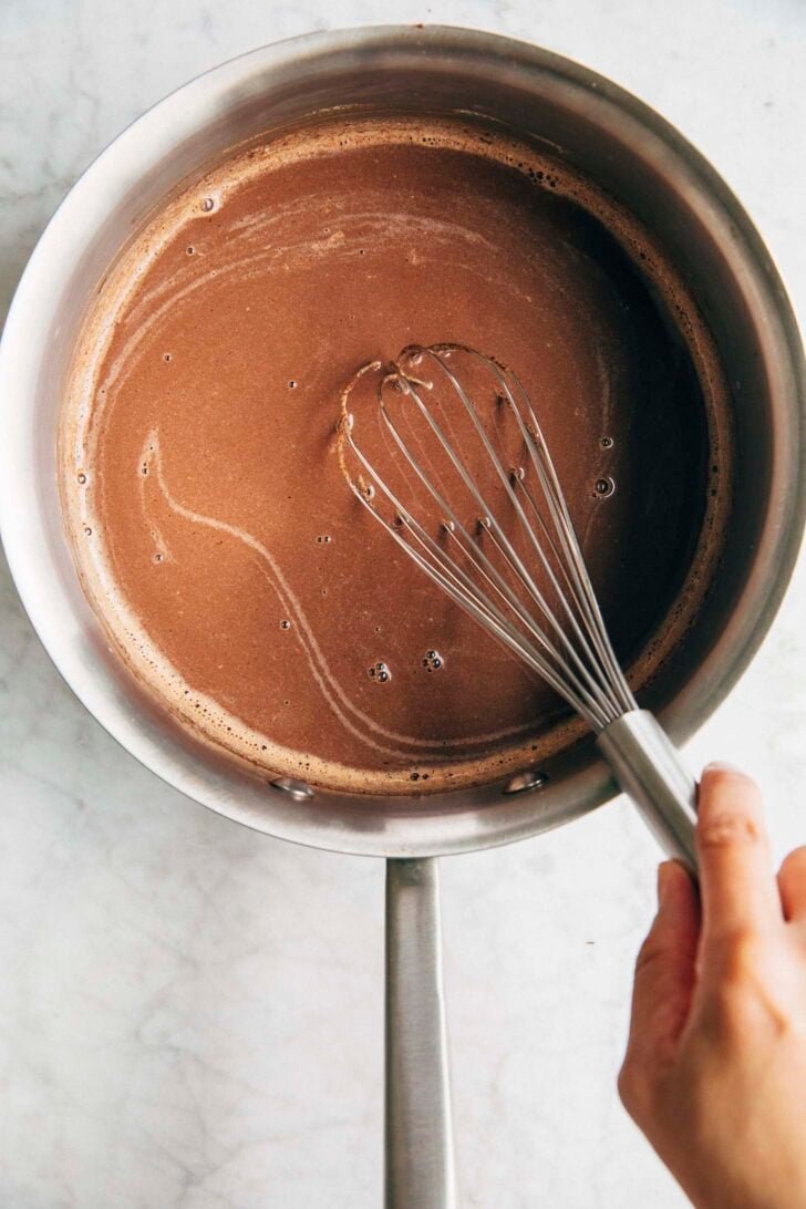 photo showing that whisking the mixture incorporates the chocolate into the milk