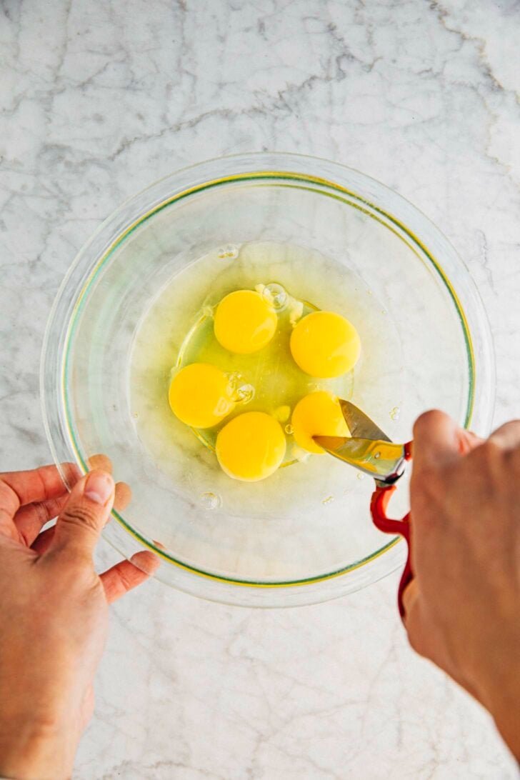 photo of michelle from hummingbird high cutting eggs for the cake batter