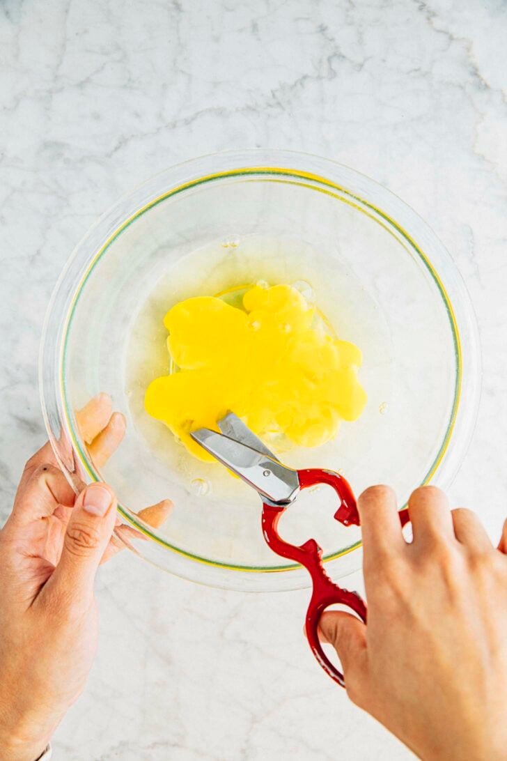 photo of michelle from hummingbird high cutting eggs for the cake batter