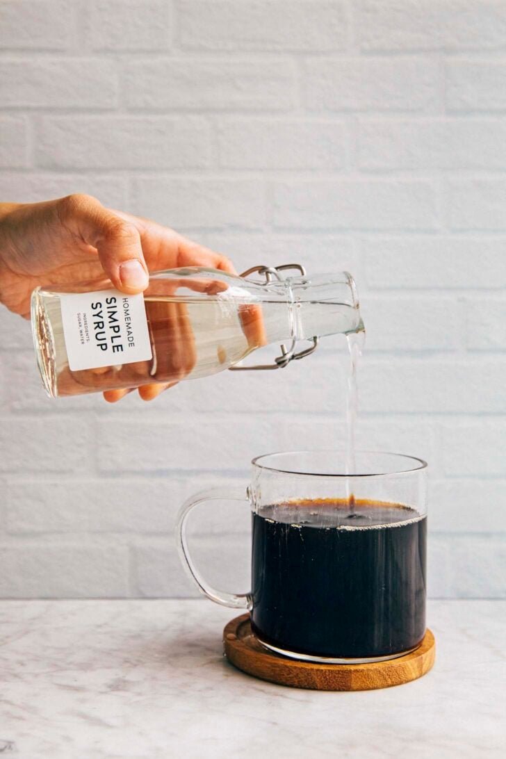 photo of simple syrup being poured into a coffee