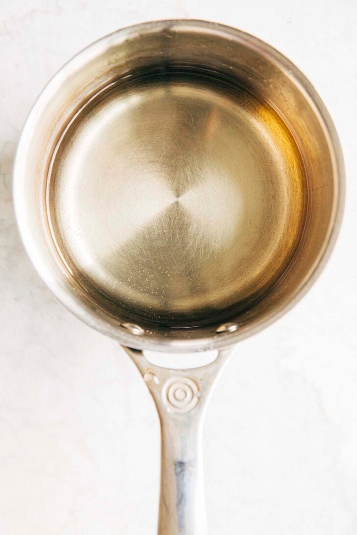 photo of simple syrup in the pan after it's been made showing the clear color