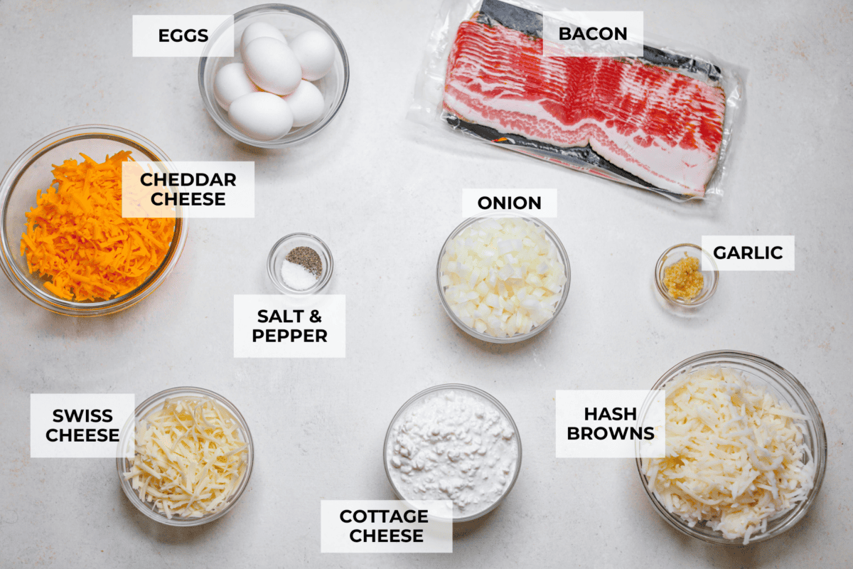 Kickstart your day with this hearty Amish Breakfast Casserole! It's loaded with crispy bacon, tender hash browns, and gooey melted cheese. This dish is a crowd-pleaser that’s perfect for family breakfasts and holiday mornings! Overhead shot of labeled ingredients.