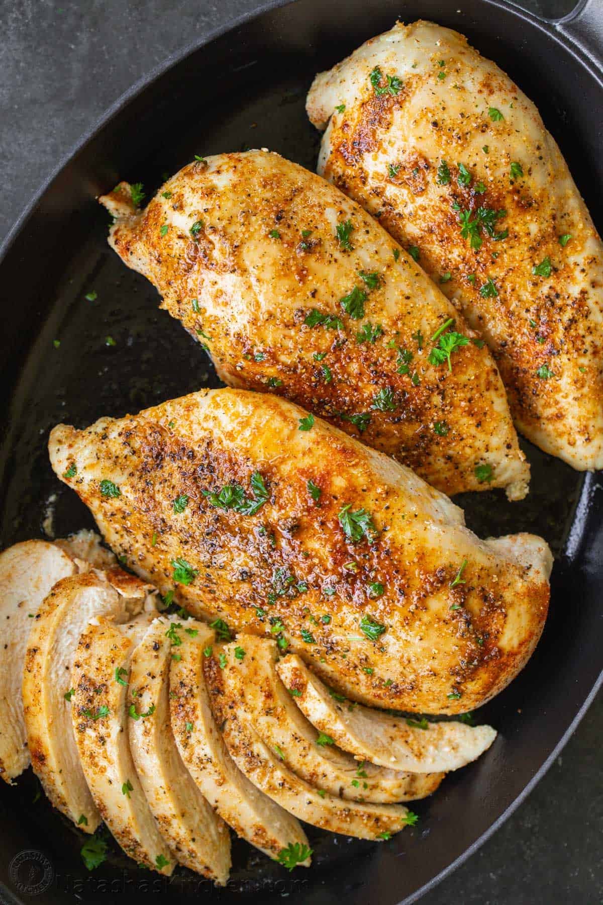 This Baked Chicken Breast is tender, juicy, and perfectly seasoned - versatile and great for meal prep! Say goodbye to dry, boring chicken! oven baked chicken breast in a pan