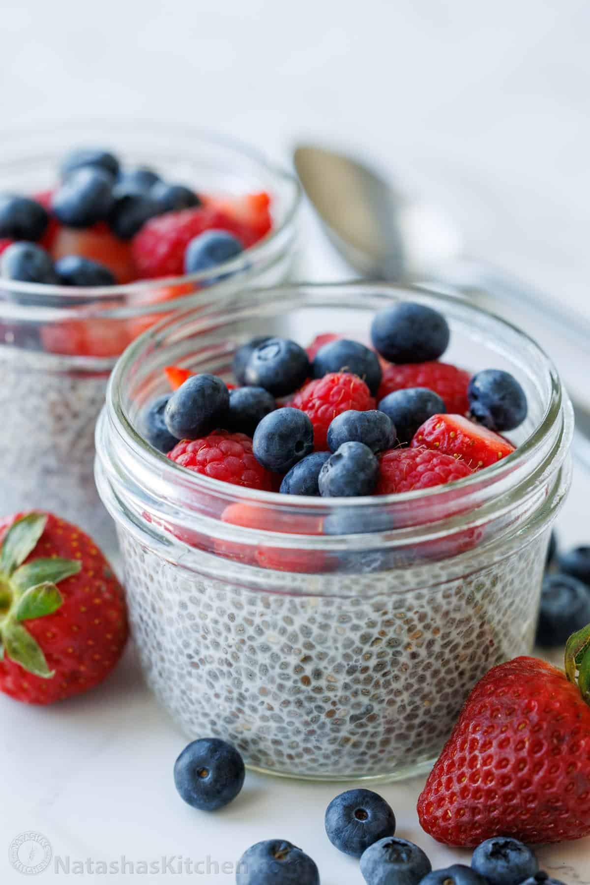 Chia Seed Pudding uses only 3 ingredients to make a delicious and filling breakfast you can prep ahead. Add toppings for the perfect bite. Simple chia seed pudding recipe in mason jars with berries on top