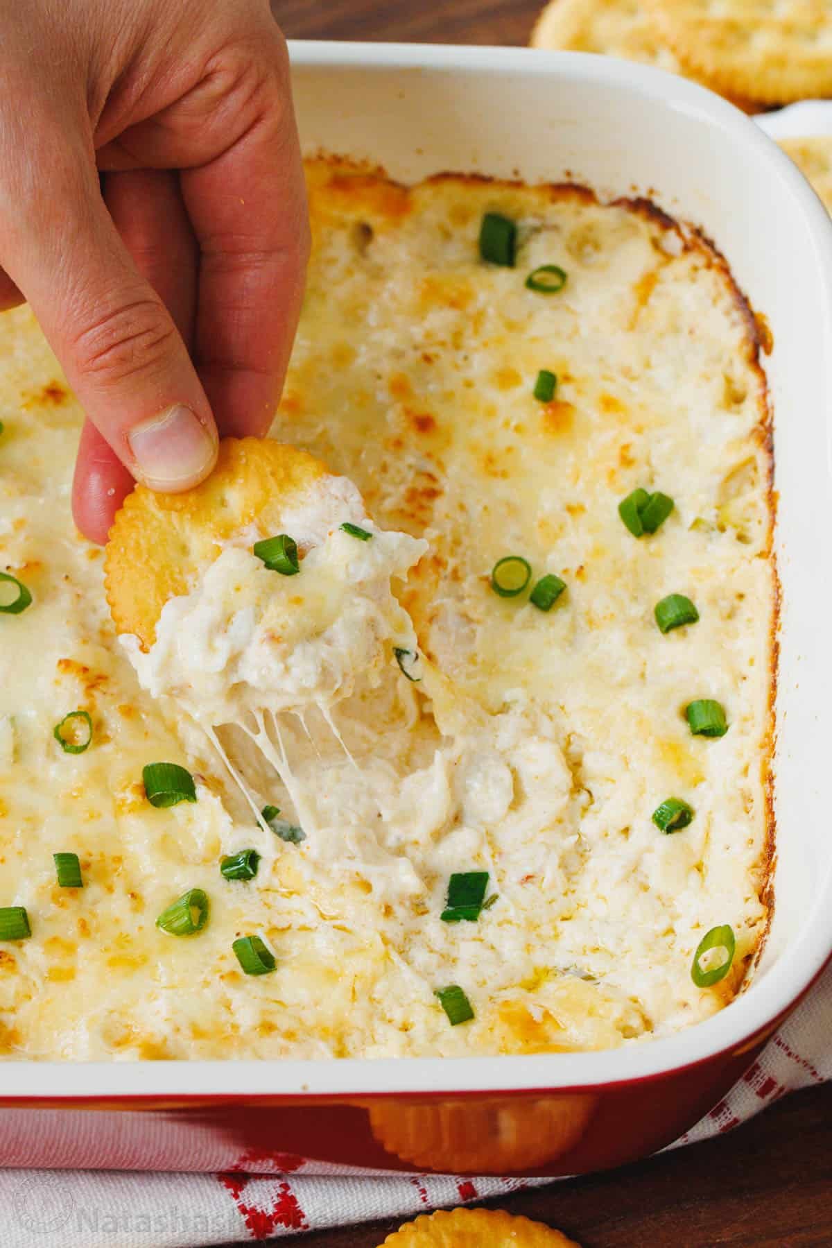 Creamy and cheesy hot Crab Dip is irresistibly good. It's loaded with lump crab meat and will be the star appetizer of your holiday menu. Crab dip served with cracker