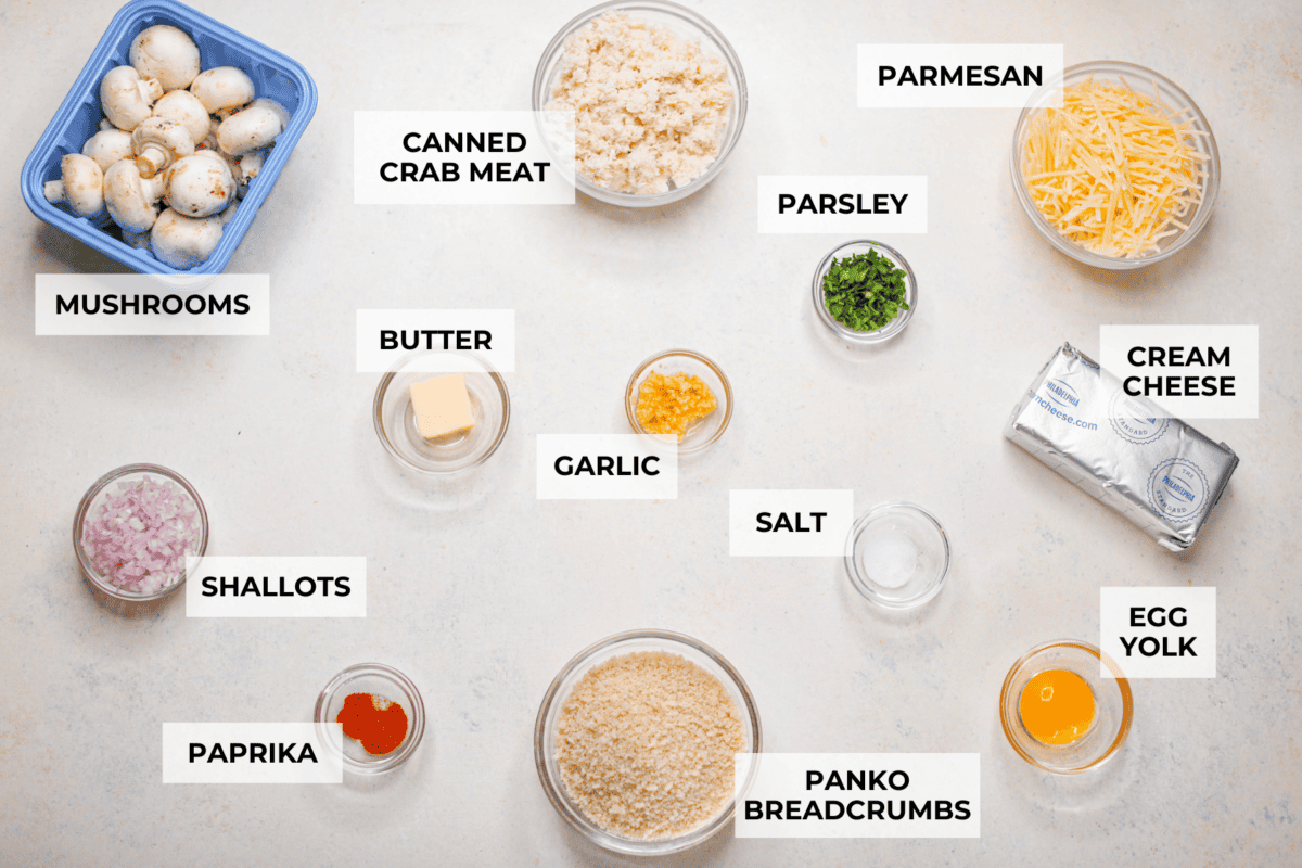 These Crab Stuffed Mushrooms are a deliciously savory appetizer, perfect for impressing guests at any gathering. With a rich crab filling in every bite, they’re sure to be a crowd favorite! Overhead shot of labeled ingredients.