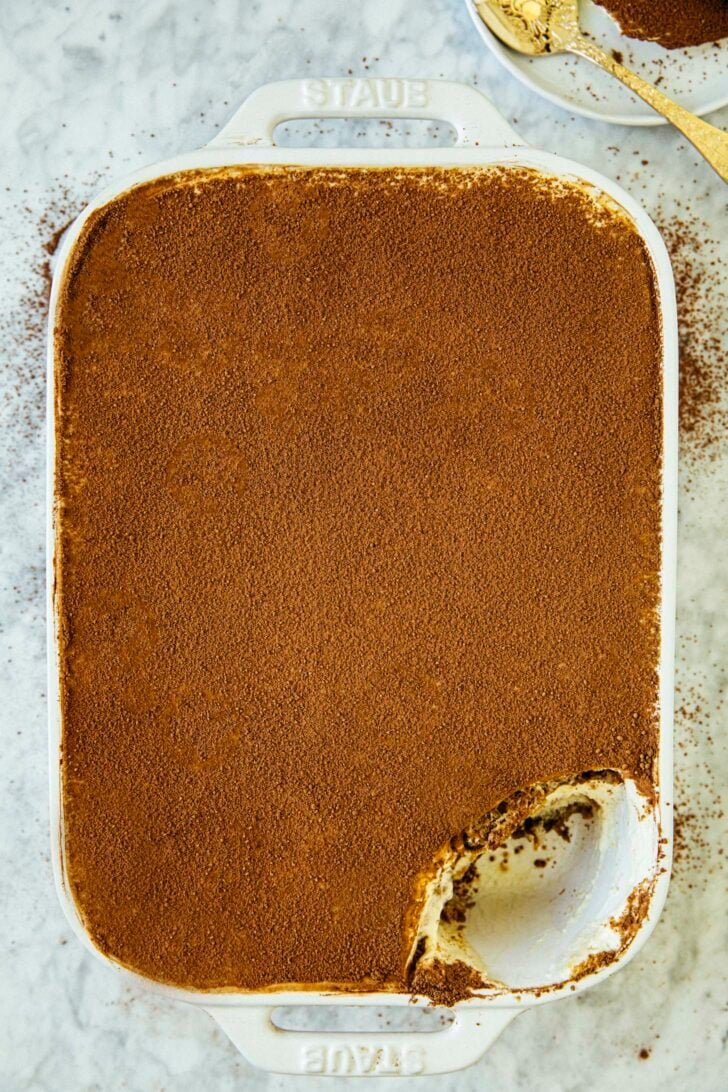 photo of classic tiramisu with a scoop removed