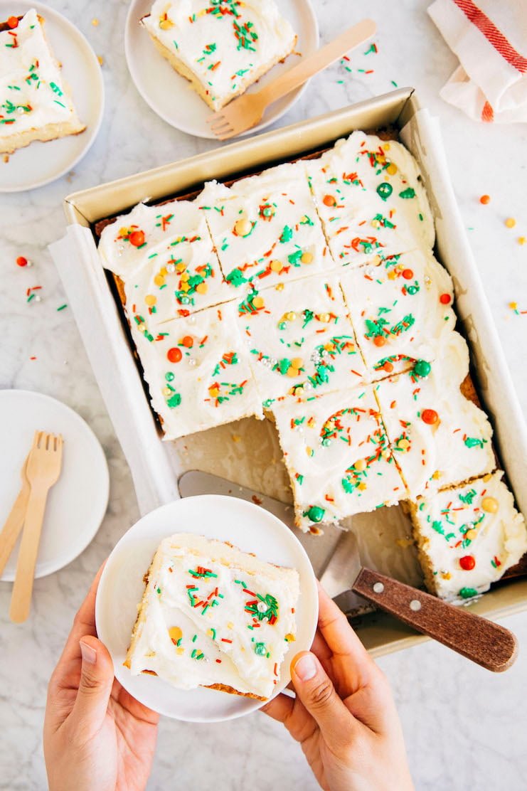 hands holding eggnog cake