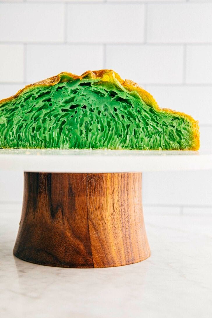 photo of vietnamese honeycomb cake sliced on a cake stand