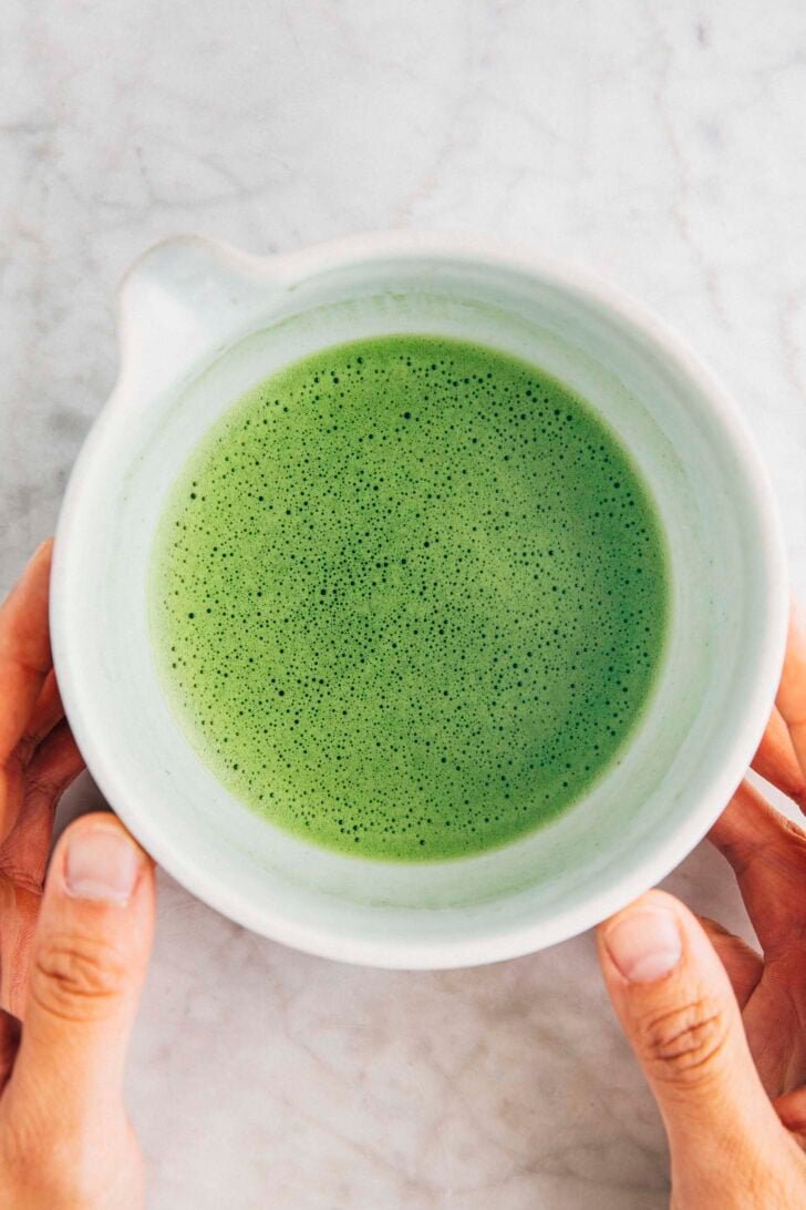 photo of the perfect matcha shot for lattes in a matcha bowl showing off the light and frothy microfoam texture