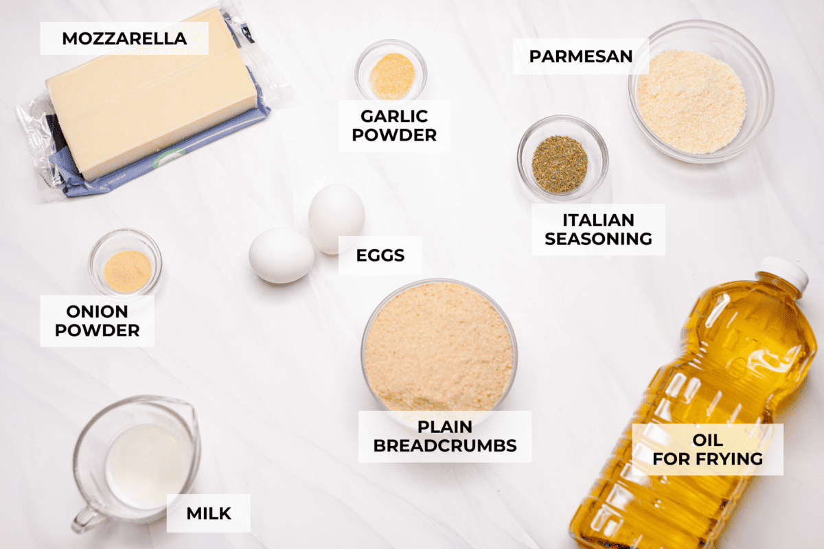 The secret to perfect mozzarella sticks comes down to three key steps: using the right mozzarella, double breading for a sturdy crust, and fully freezing them before frying. I’ve broken down these expert tips below! Overhead shot of labeled ingredients.
