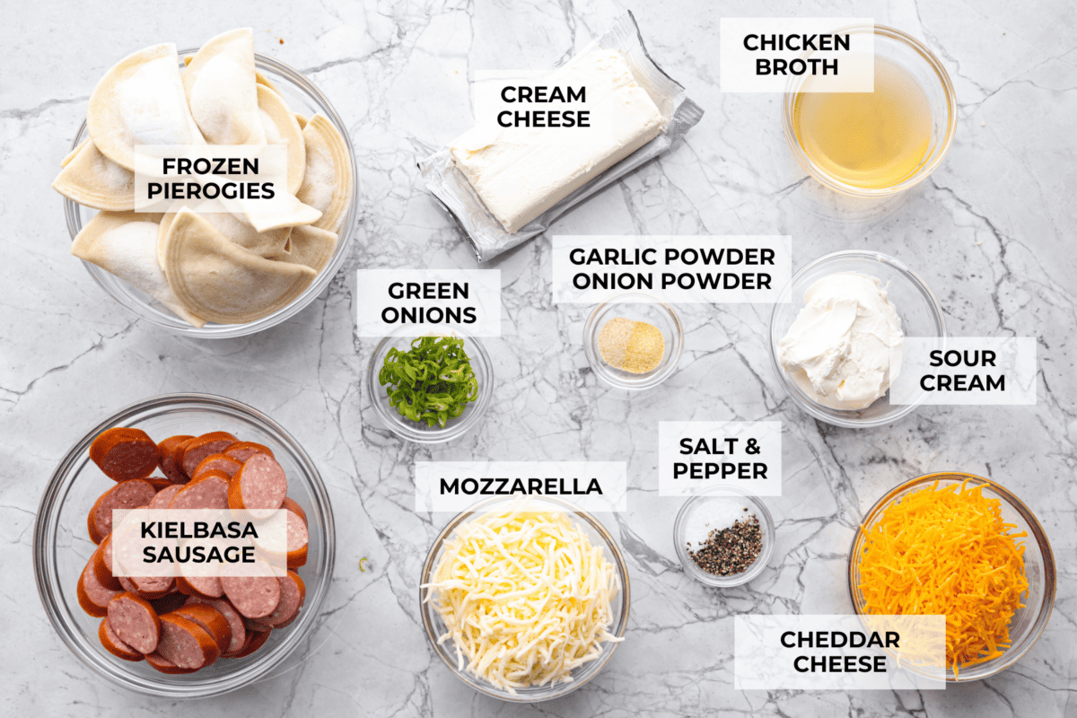 This isn’t your average Pierogi Casserole. While most stick to one type of cheese, I use a blend for ooey-gooey cheesy creaminess and cozy flavor in every bite. Overhead shot of labeled ingredients.