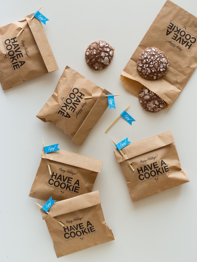 Let's make some cookie gifts! Cookie gift bags with \"enjoy\" labeled pick closures and homemade cookies.