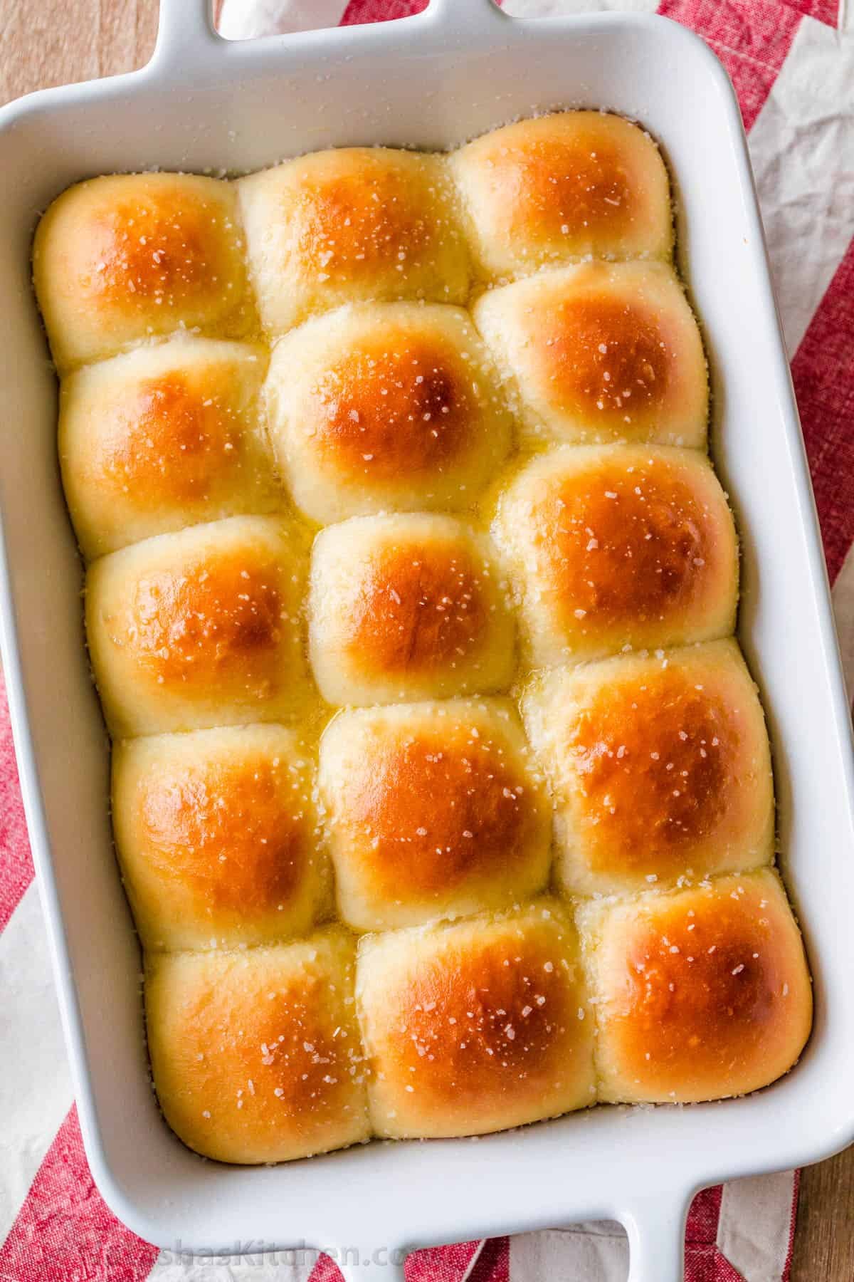 Irresistibly Soft Dinner Rolls are easy with just 6 ingredients. Fluffy homemade bread rolls are holiday-worthy and make-ahead friendly! Dinner Rolls baked in casserole dish brushed with butter