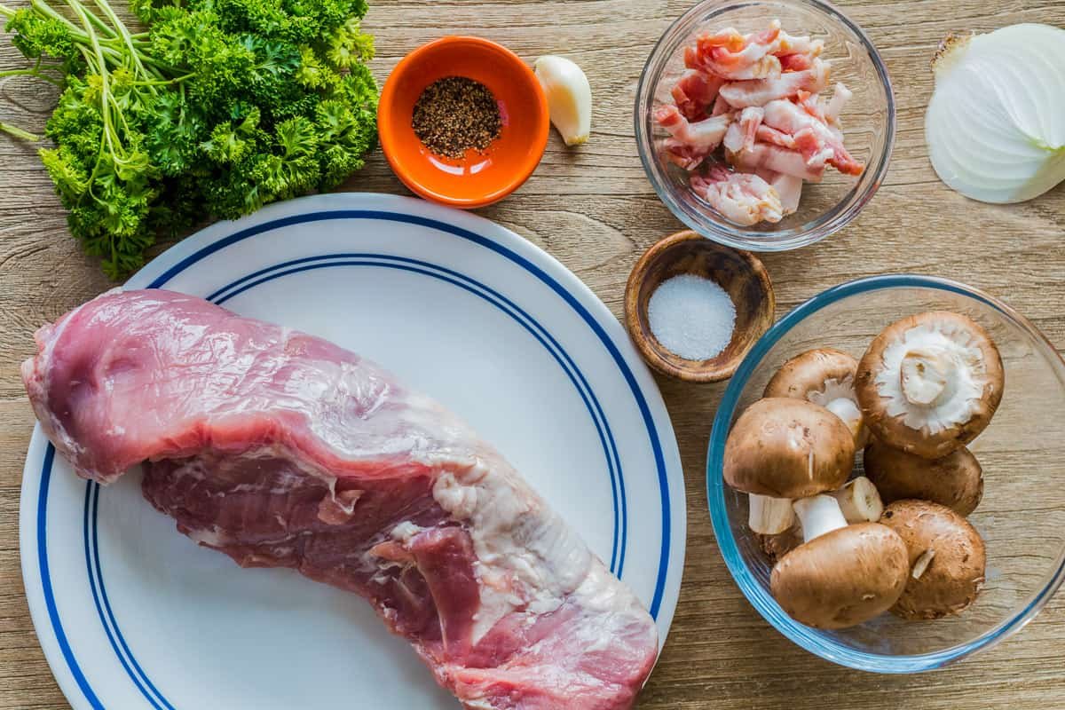 Juicy Stuffed Pork Tenderloin recipe loaded with mushrooms and bacon. With just a few ingredients, this easy pork recipe is a crowd favorite! Ingredients for Main Meat Dish with mushrooms, bacon, salt, pepper, garlic, onion and protein