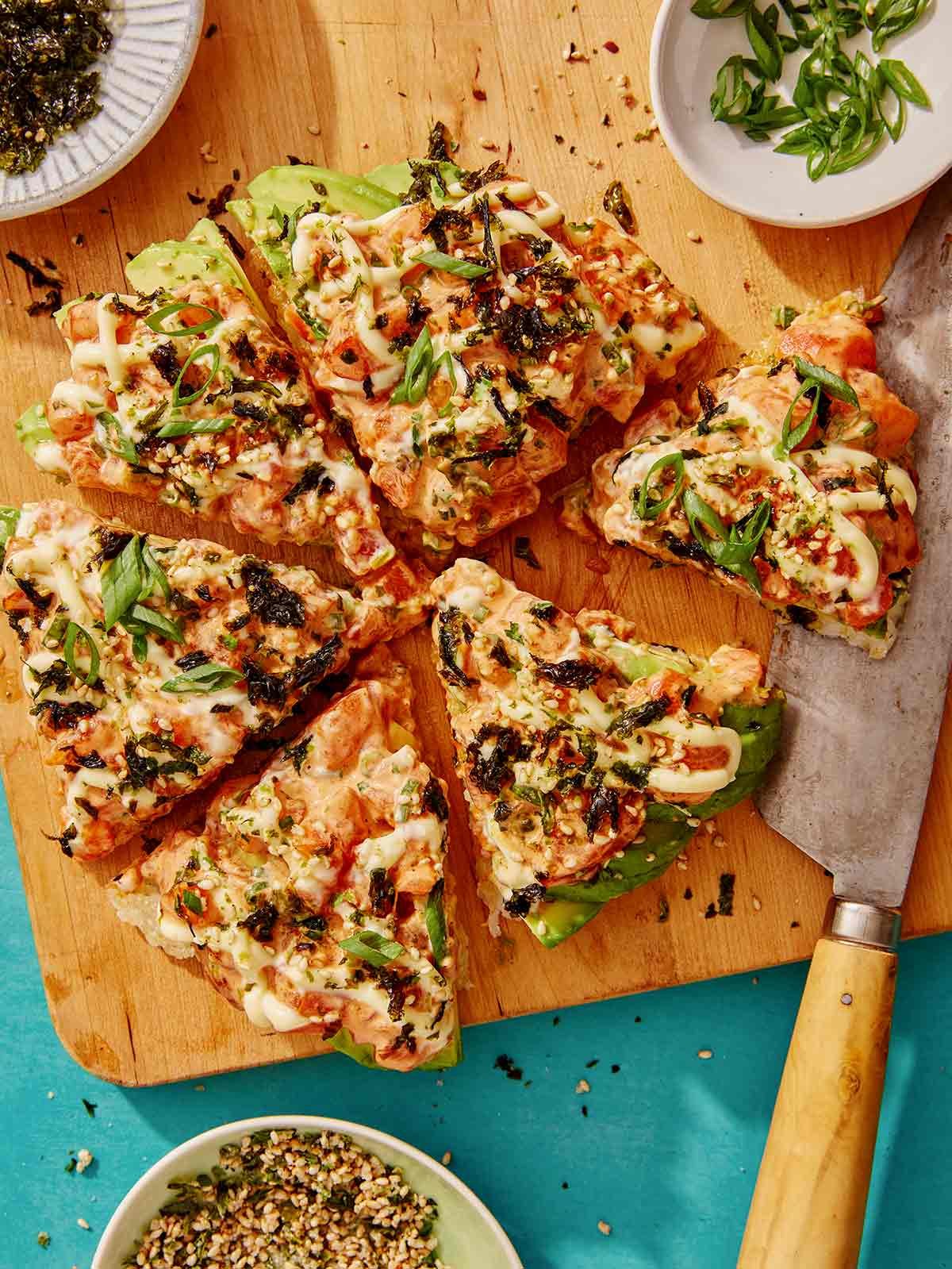 Sushi pizza recipe on a cutting board. 