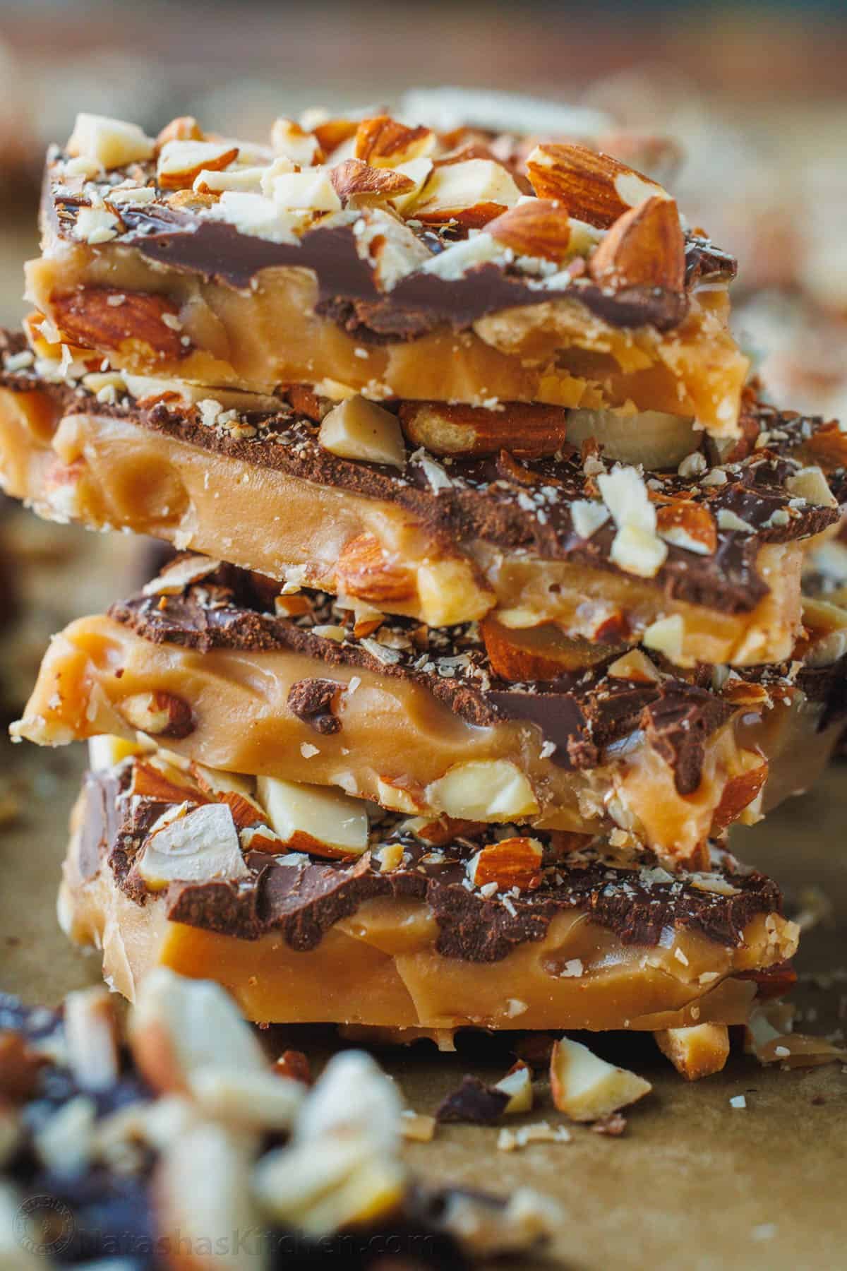 Our toffee recipe is buttery and crunchy with delicious layers of candy, chocolate and almonds. It's easy to make with only 5 ingredients. Toffee candy stacked up high with almonds and chocolate
