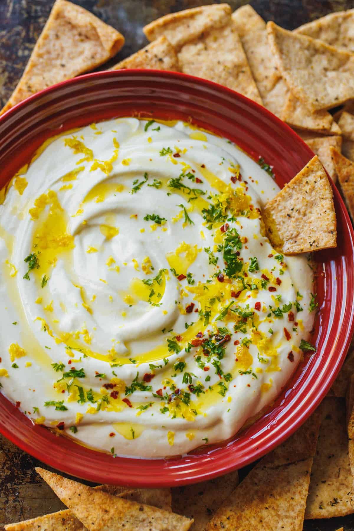 whipped feta dip garnished and served with pita chips. 