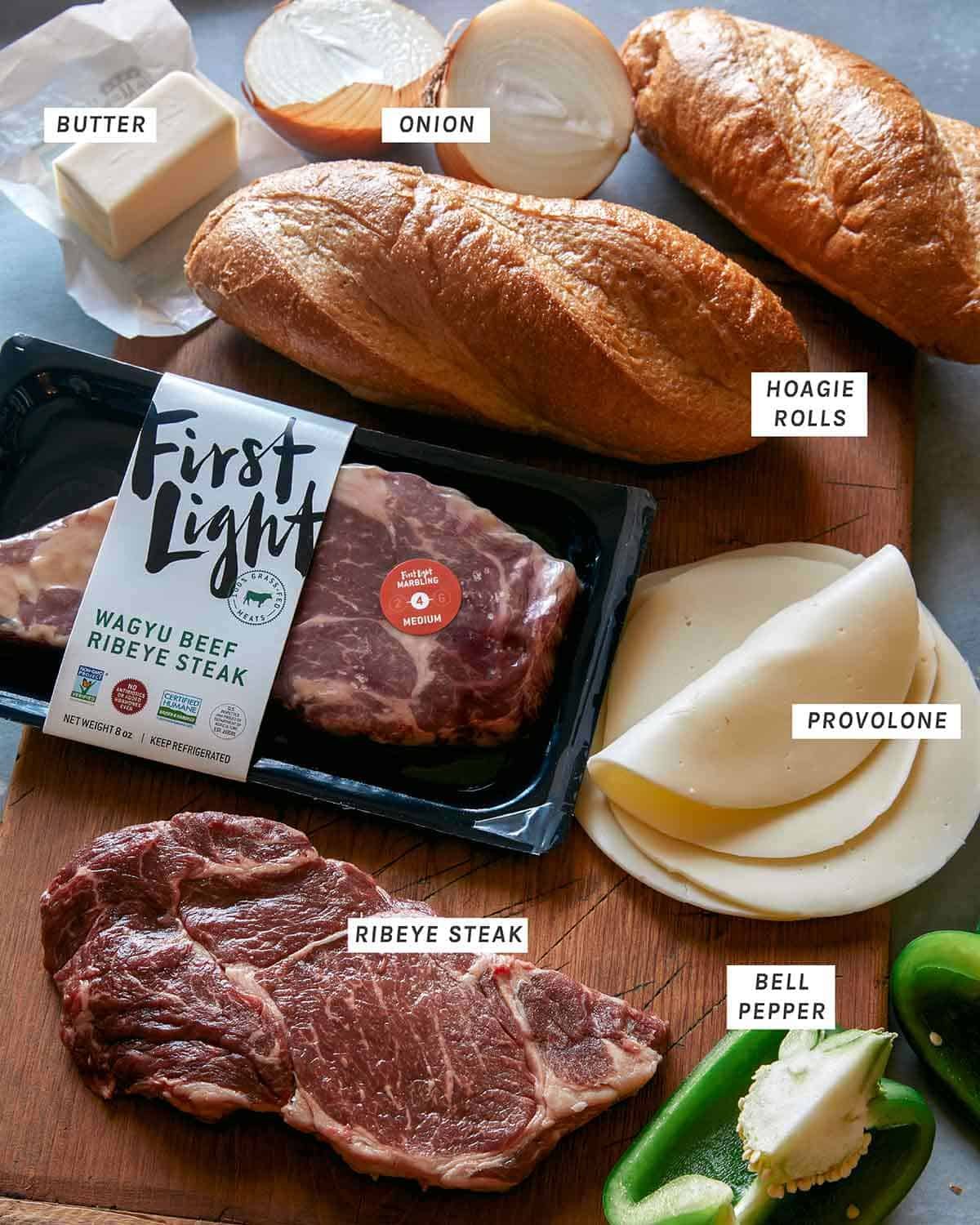 Ingredients to make a Philly Cheesesteak sandwich in a kitchen.