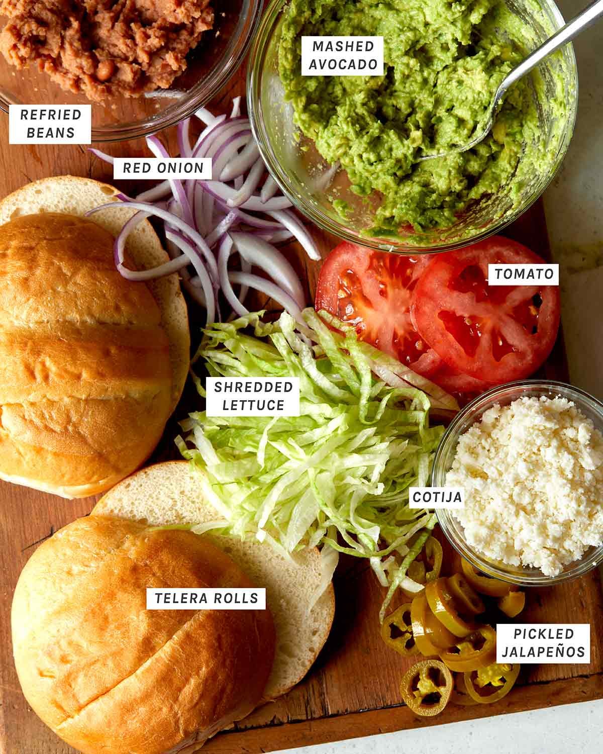 An image showing all the sandwich toppings for a carne asada torta.