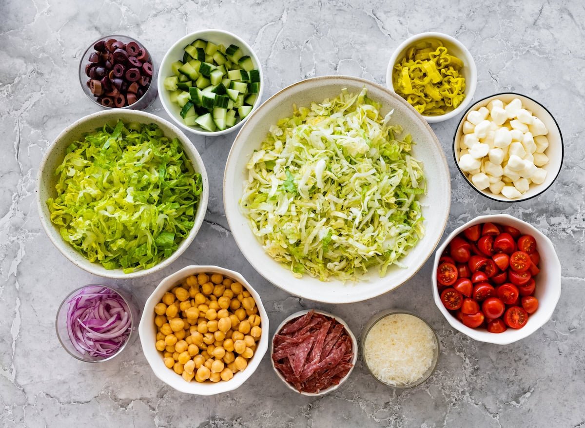 ingredients in bowls to make Italian chopped salad.