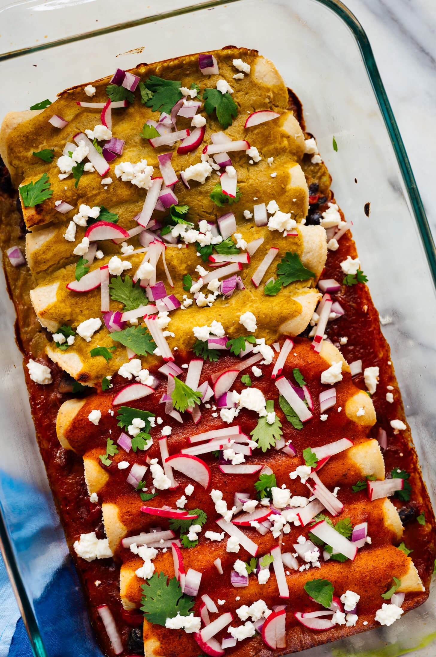 green sauce on enchiladas