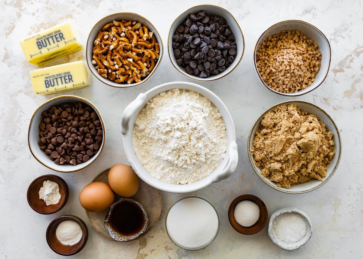 ingredients in bowls to make pretzel toffee chocolate chip cookies.