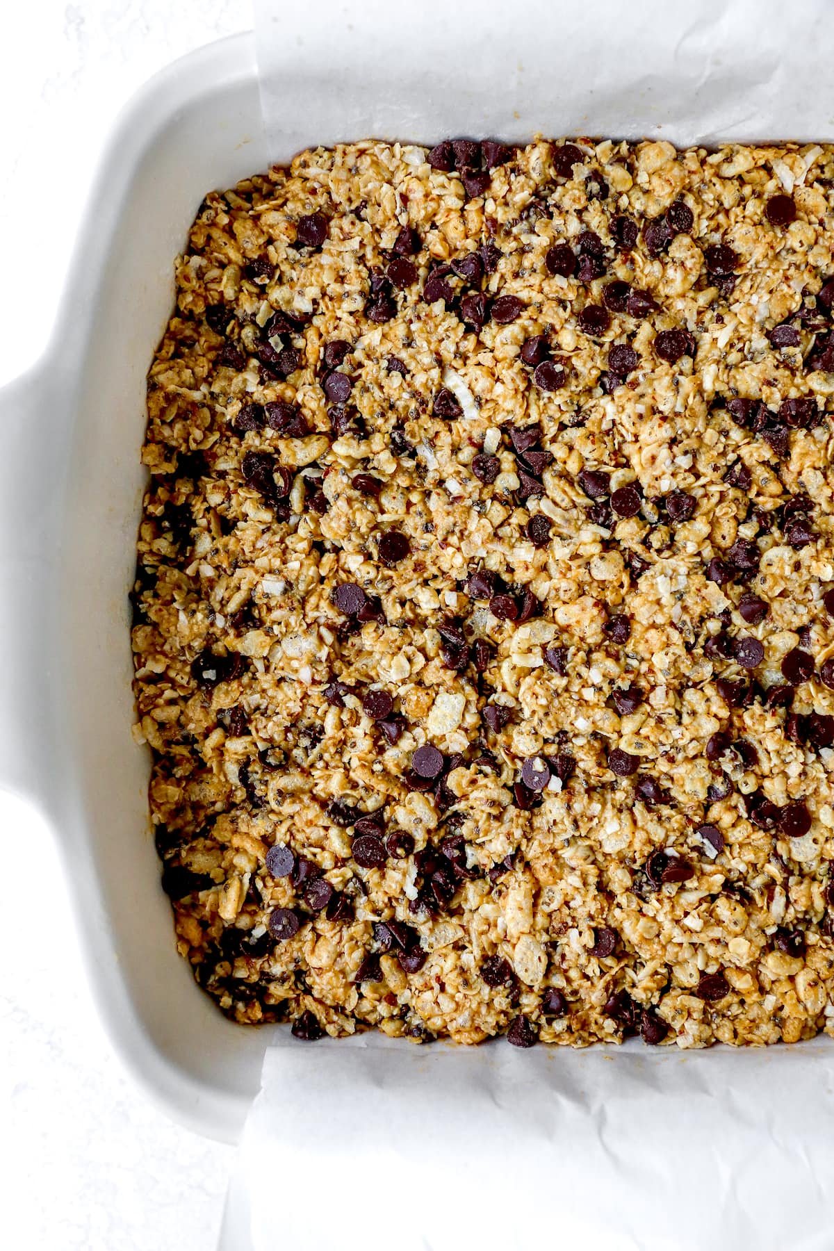 granola bars with chocolate chips in pan. 