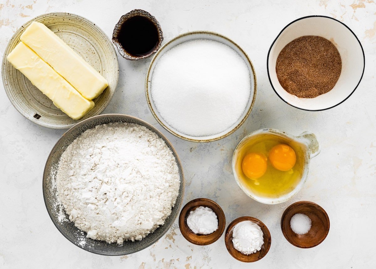 snickerdoodle recipe ingredients in bowls.