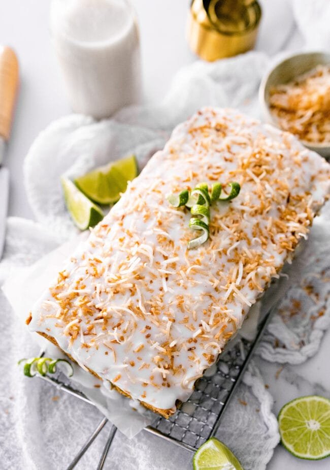 lime zucchini loaf cake with a slice missing.
