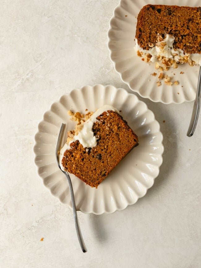 slices of carrot cake loaf on plates with forks