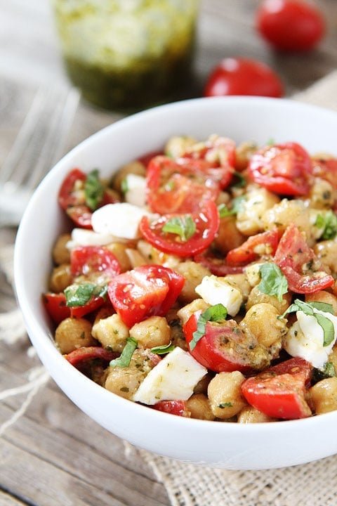 Chickpea, Pesto, Tomato, and Mozzarella Salad Recipe Chickpea, Pesto, Tomato, and Mozzarella Salad Recipe on twopeasandtheirpod.com You can make this healthy salad in under 10 minutes! #salad #recipe