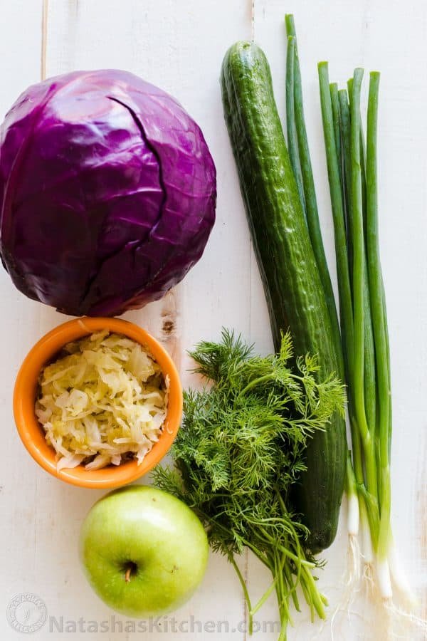 Ingredients for Red Cabbage Salad with Purple Cabbage, cucumber Granny smith apple, green onion, sauerkraut, dill and green onion