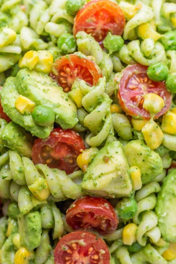 Avocado Pasta Salad close up with avocados and tomatoes in pasta salad
