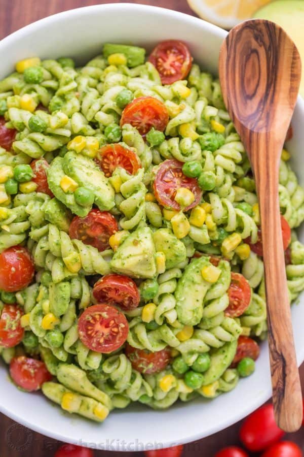 Pasta Salad Recipe for Creamy avocado pasta salad in a bowl with avocado, tomatoes and corn