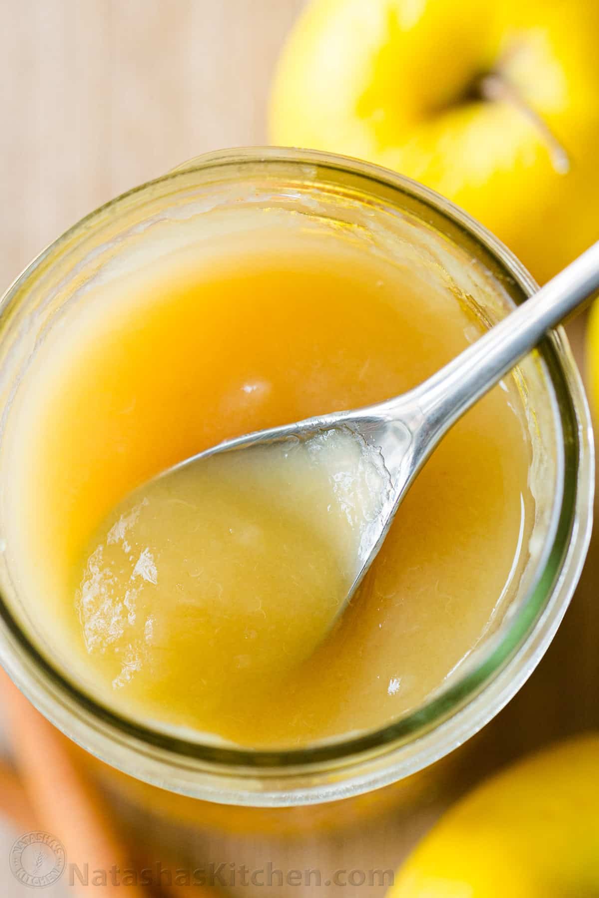 There's nothing like Homemade Applesauce with fresh apple flavor. Use very ripe apples and you don't even need to add sugar. How to make and can applesauce. #applesauce #applesaucerecipe #howtomakeapplesauce #apples #howtocanapplesauce #natashaskitchen #canningrecipes Apple sauce recipe in jar with spoon