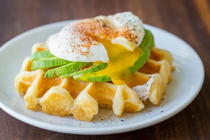Homemade Waffle Recipe with the secret to super fluffy waffles! Perfect for sweet or savory waffles, and American or Belgian waffle makers. Savory waffle with avocado and poached egg