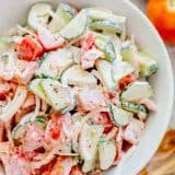 This CLASSIC creamy cucumber and tomato salad is so simple to make and is our go-to summer salad. An easy, excellent cucumber tomato salad. KEEPER! | natashaskitchen.com