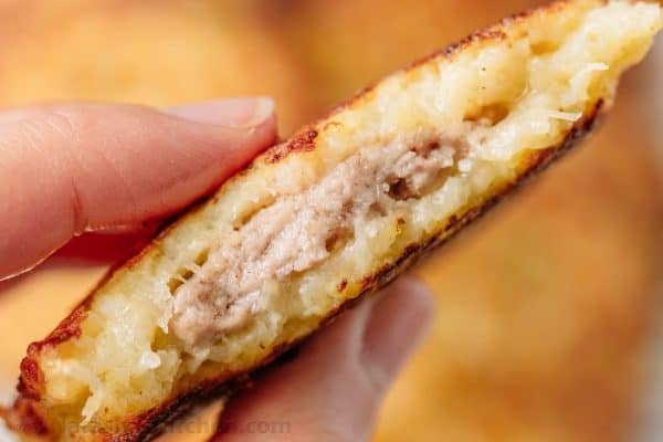 Draniki (aka deruny), are Russian stuffed potato pancakes made with grated potatoes. These are stuffed with a juicy meat patty - a delicious surprise! | natashaskitchen.com