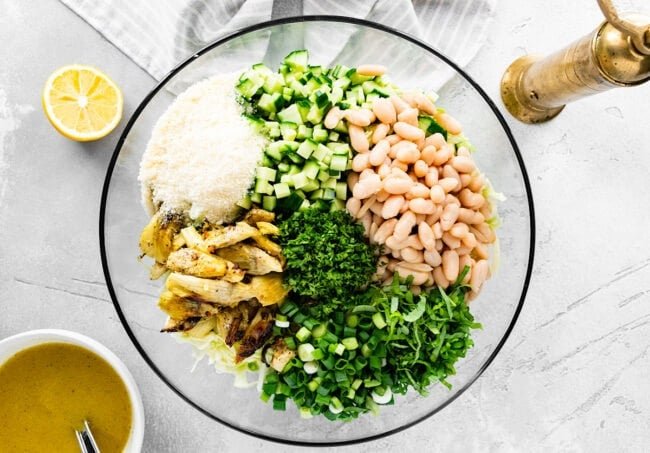 crispy artichoke white bean salad ingredients in bowl
