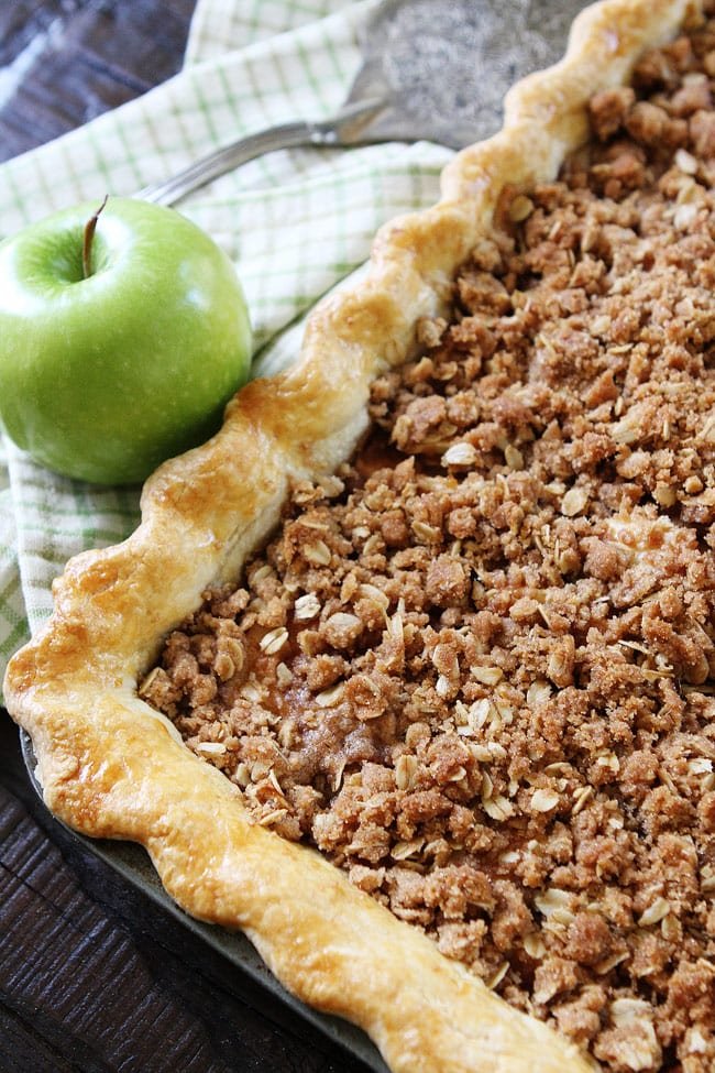 Apple Slab Pie with Crumb Topping Recipe on twopeasandtheirpod.com This easy apple pie is made in a jelly roll pan and is perfect for feeding a crowd. It is the BEST apple pie recipe. Apple Slab Pie with Crumb Topping Recipe
