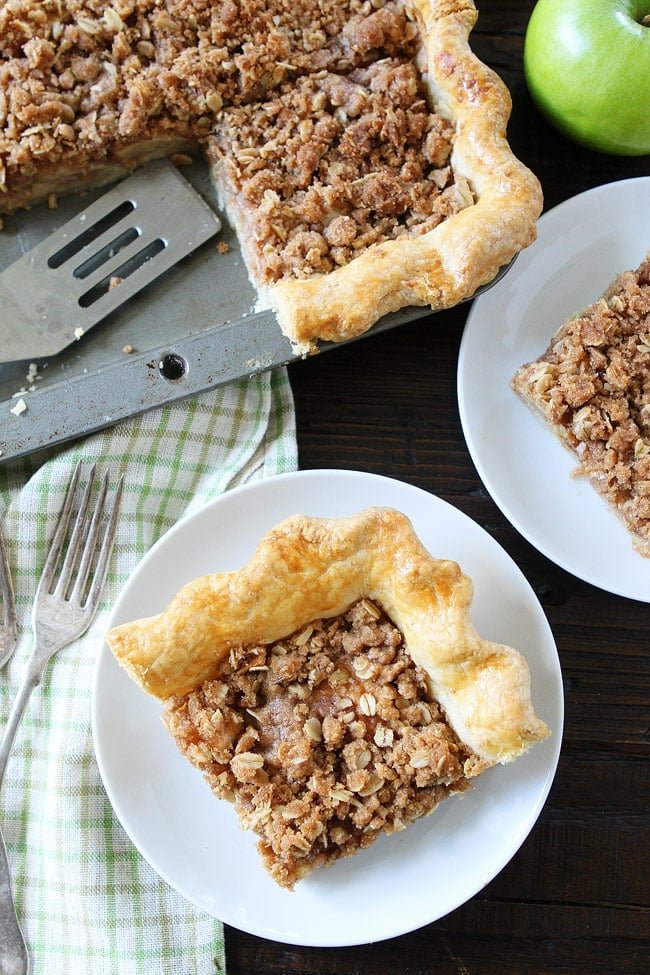 Apple Slab Pie with Crumb Topping Recipe on twopeasandtheirpod.com This easy apple pie is made in a jelly roll pan and is perfect for feeding a crowd. It is the perfect pie for the holidays! Apple Slab Pie with Crumb Topping Recipe
