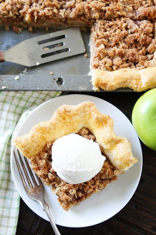 Apple Slab Pie with Crumb Topping Recipe on twopeasandtheirpod.com This easy apple pie is made in a jelly roll pan and is perfect for feeding a crowd. It is the BEST apple pie recipe. Everyone LOVES it! Apple Slab Pie with Crumb Topping Recipe