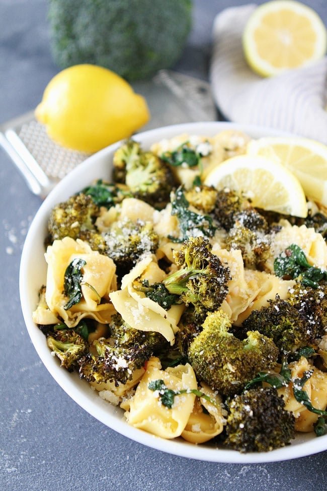 Lemon Broccoli Tortellini Recipe on twopeasandtheirpod.com This easy cheese tortellini pasta dish is a favorite weeknight meal. It is full of flavor and easy to make! Cheese Tortellini Recipe with lemon roasted broccoli and parmesan cheese
