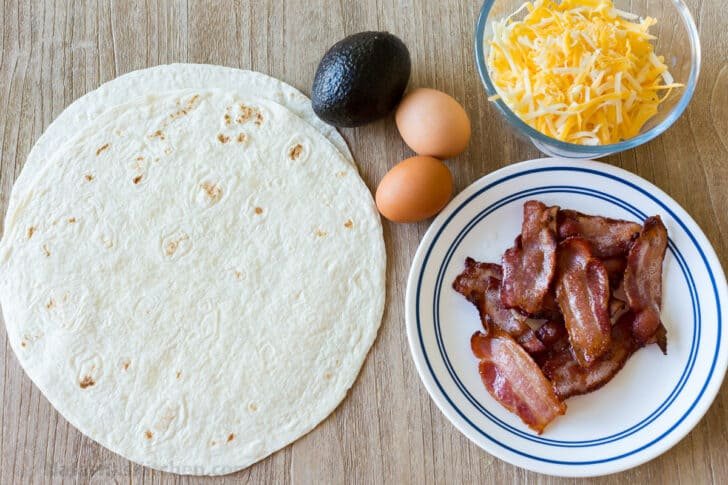 This EASY Breakfast Tortilla Fold technique went viral on TikTok and it's genius. It takes a regular Tortilla Breakfast Wrap to the next level. Ingredients for making tortilla breakfast wraps with tortillas, bacon, eggs, avocado and cheese