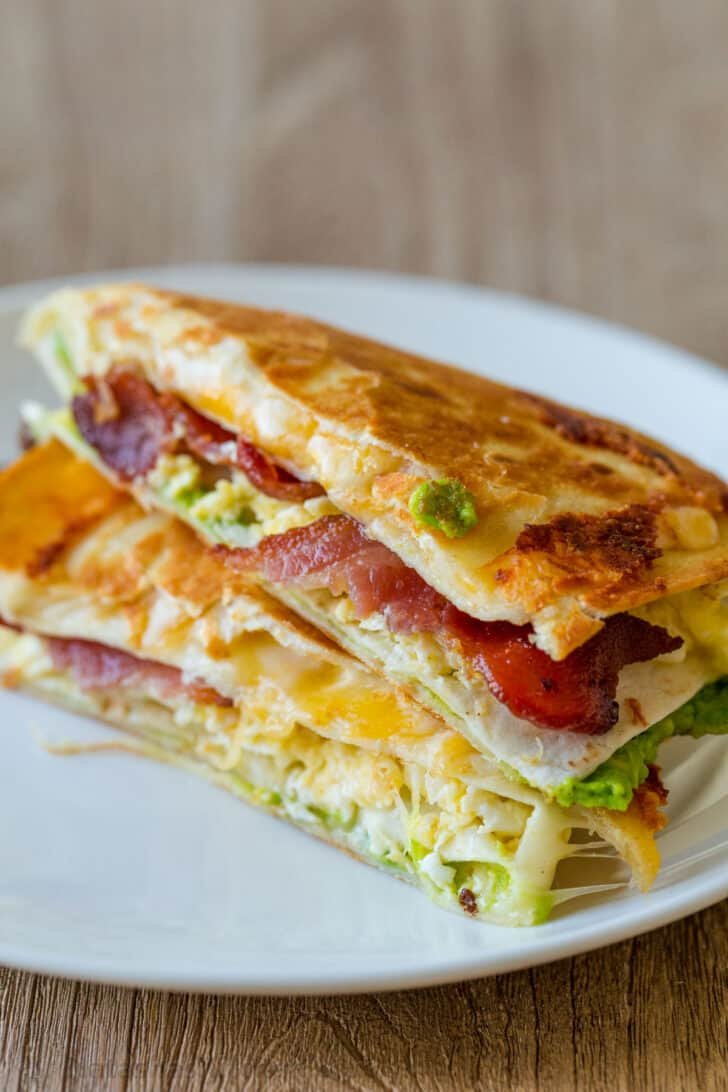 This EASY Breakfast Tortilla Fold technique went viral on TikTok and it's genius. It takes a regular Tortilla Breakfast Wrap to the next level. Stacked breakfast tortilla wraps served on a plate
